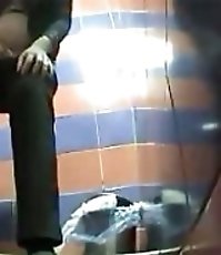 Voyeur films girls pissing in public toilet