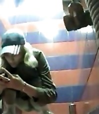 Sporty chick with hot ass takes a leak on spy cam