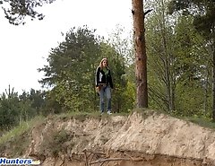 Beautiful teen plays watersports on a quiet forest glade