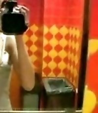 Filthy chick masturbates pussy on the toilet bowl