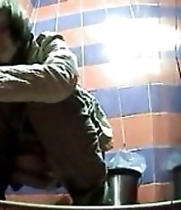 Voyeur films girls pissing in public toilet