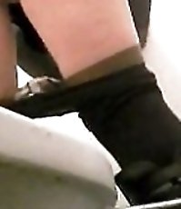 Girl goes down low to take a leak in spycammed loo