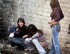 Three hot babes make a pee unaware of spying on them