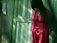 Babe in crimson piddles outdoors unaware of spying