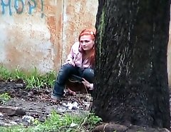 Hot girl with red hair filmed on the sly having a pee