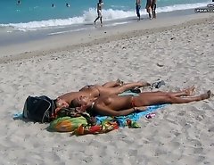 Tiny bikini panties look great on suntanned girls