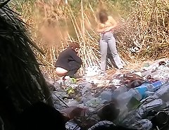 Two unsuspecting chicks make a pee in the open air